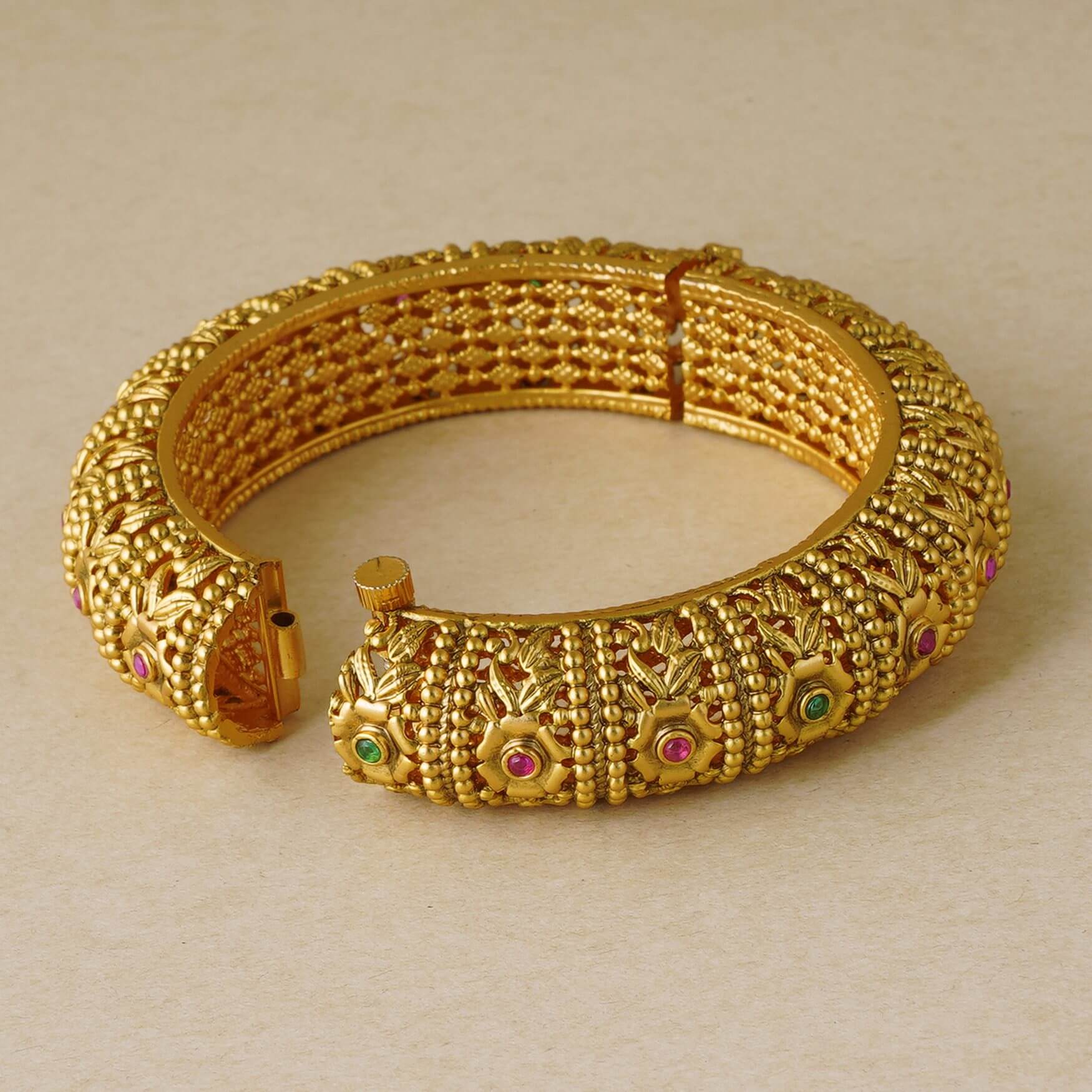 INTRICATE GOLD PLATED STONE KADA BANGLE